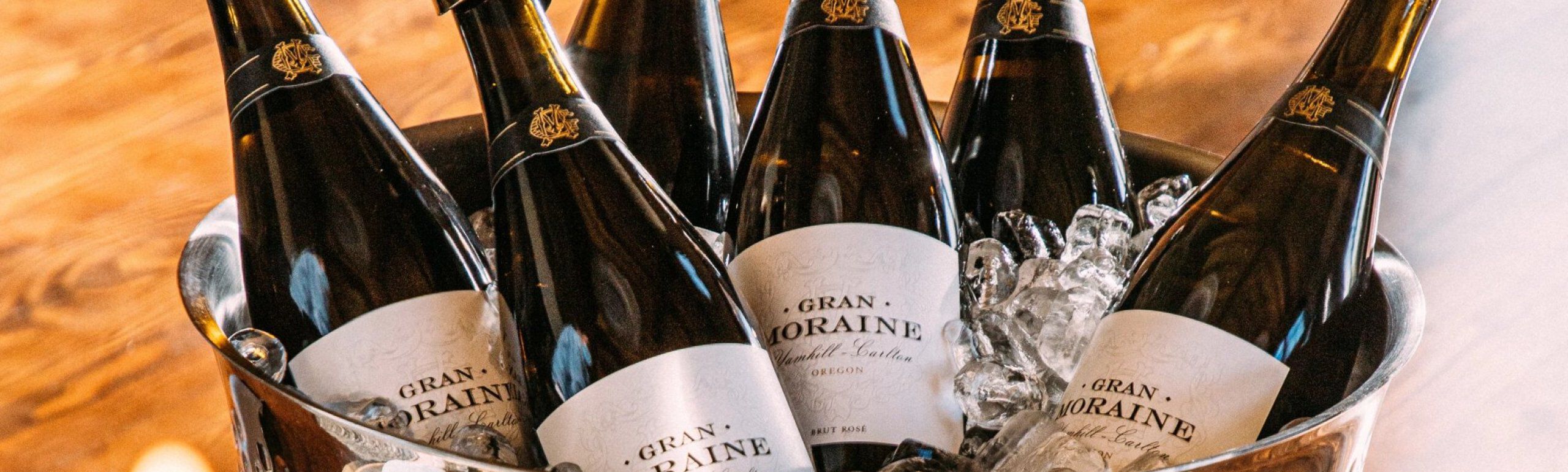 Bottles of Gran Moraine Sparkling Wine in wine bucket