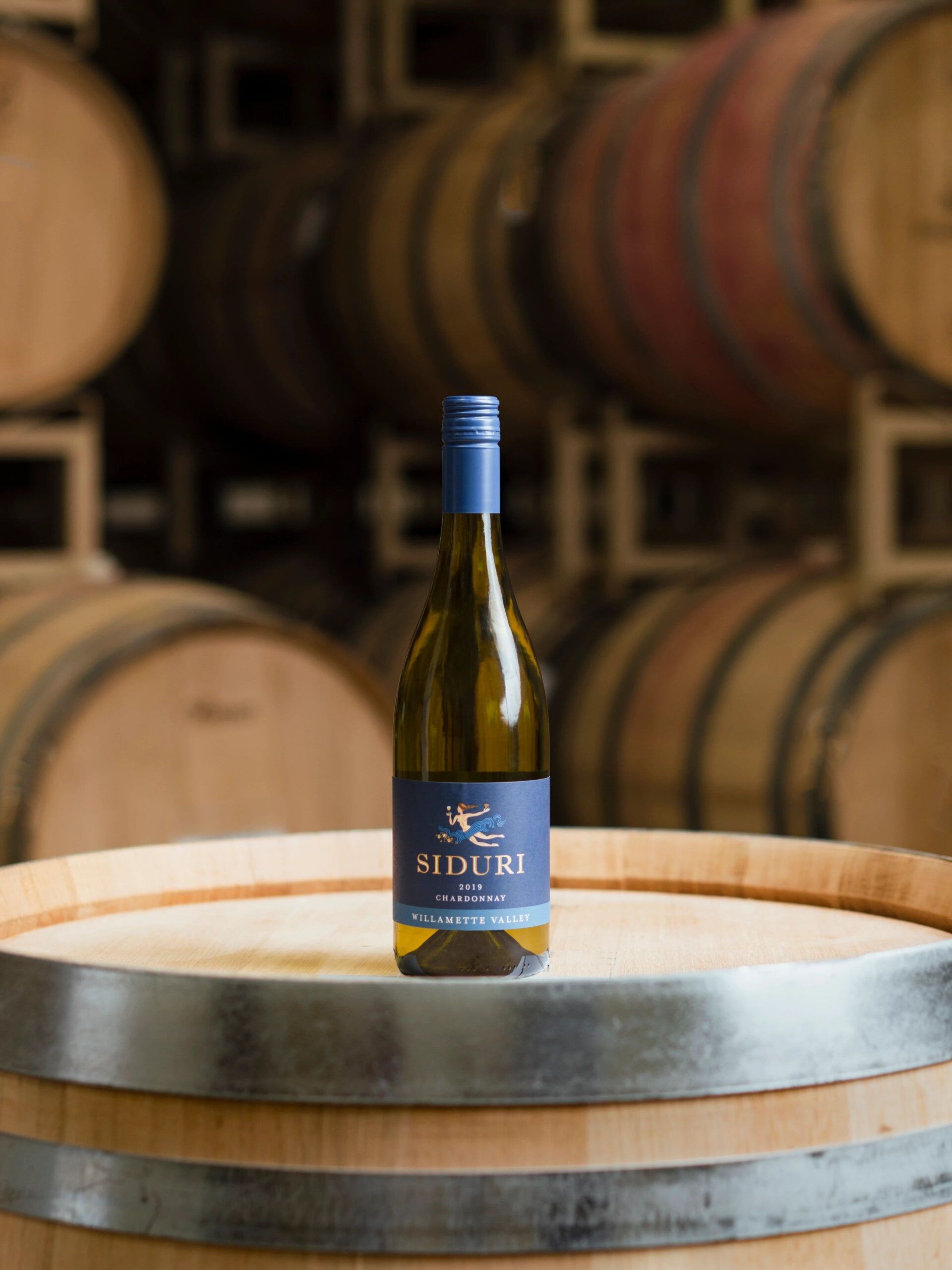 bottle of wine on barrel