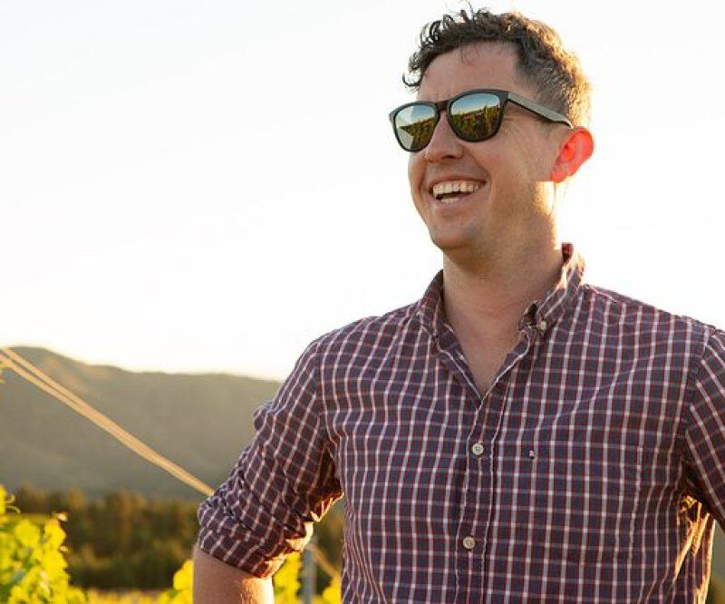 Capture Winemaker Sam Teakle standing in a vineyard