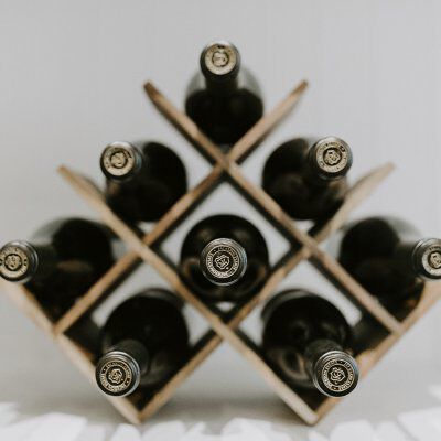 eight wine bottles in a wine rack eight wine bottles in a wine rack