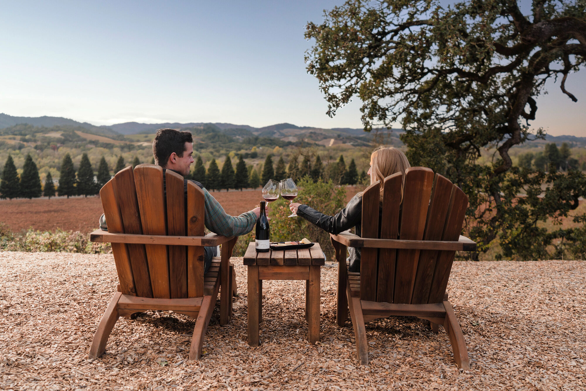 A couple enjoying the views with a tasting at Copain