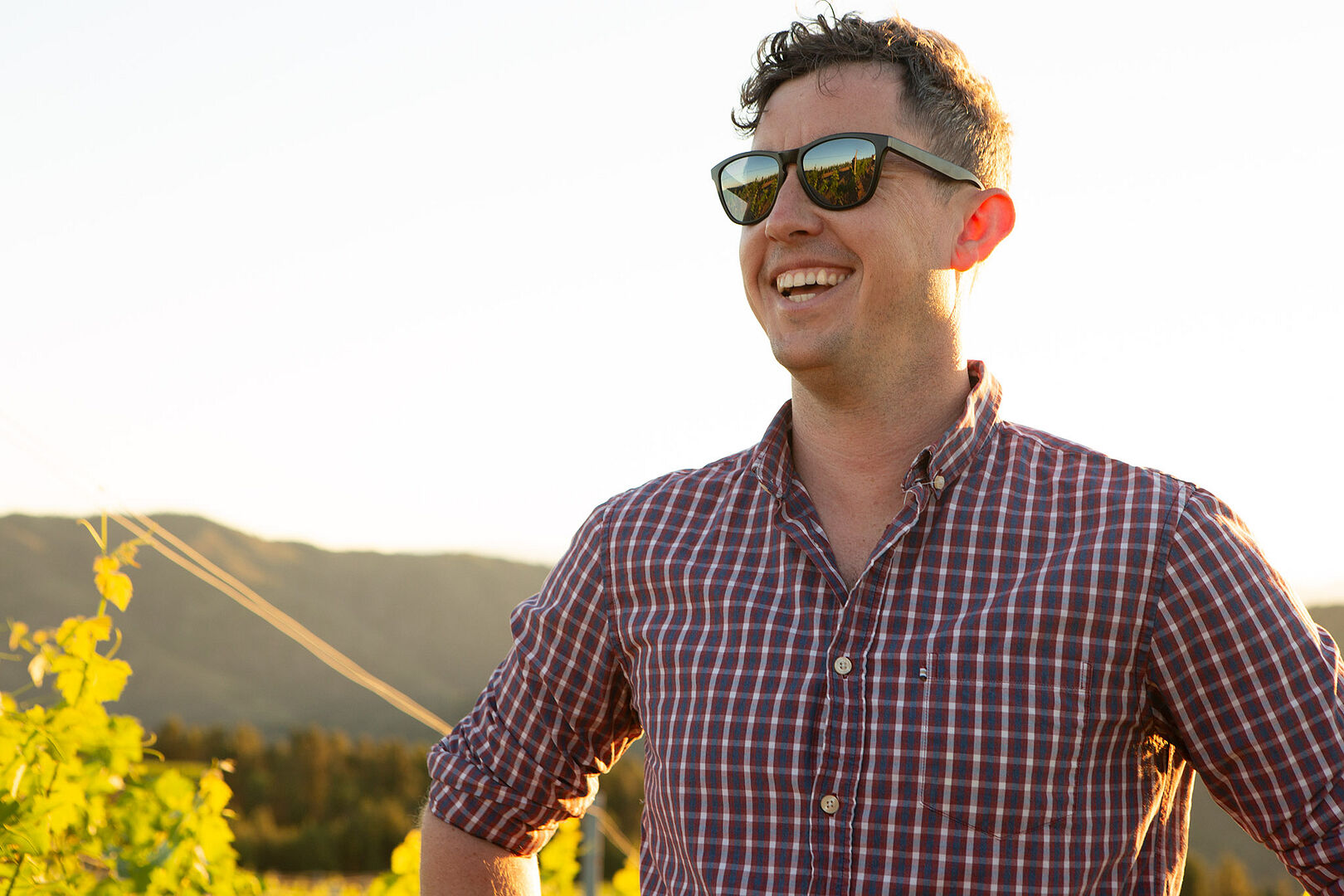 Capture Winemaker Sam Teakle standing in a vineyard