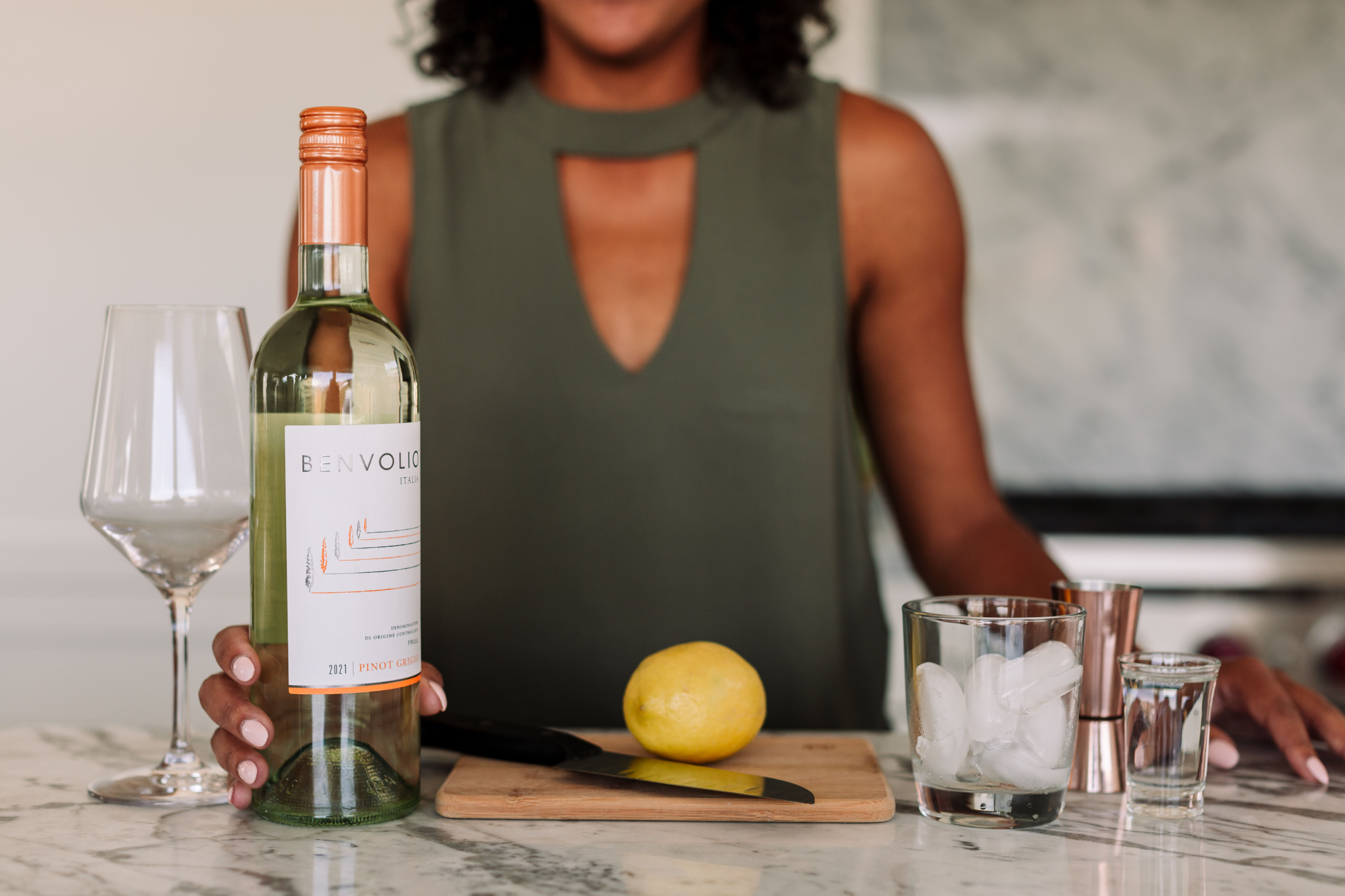 Woman preparing Benvolio Pinot Grigio spritzer